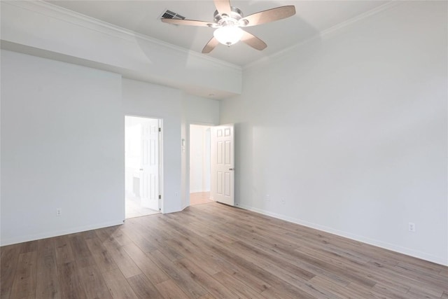6008 Sierra Leon St, Austin, TX 78759 - unfurnished room with crown molding, a ceiling fan, wood finished floors, and a towering ceiling