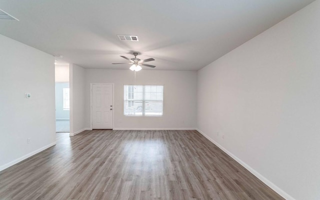 510 Timber Brook Dr, Hutto, TX 78634 - unfurnished room featuring ceiling fan, baseboards, wood finished floors, and visible vents