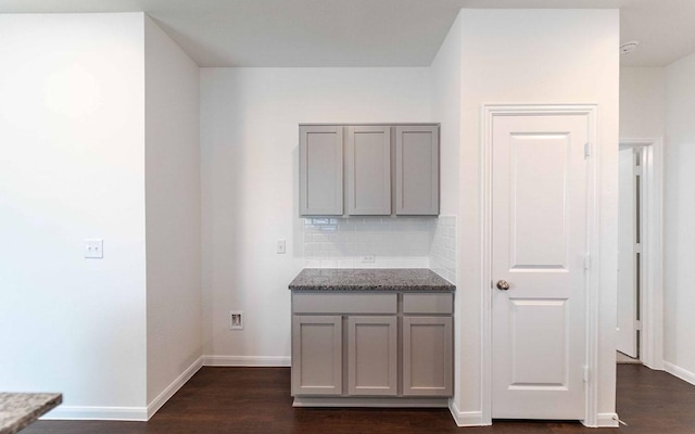 108 Biscayne Dr, Hutto, TX 78634 - hall with baseboards and dark wood-type flooring