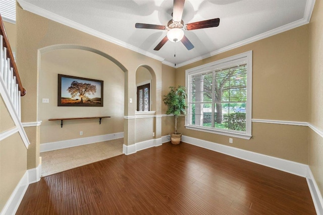 901 Middle Brook Dr, Leander, TX 78641 - empty room featuring ornamental molding, baseboards, a ceiling fan, and wood finished floors