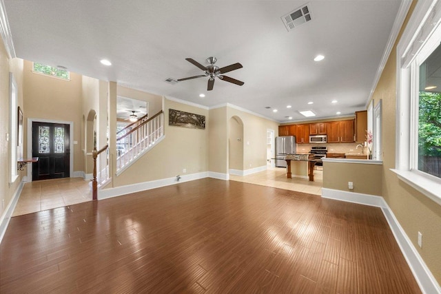 901 Middle Brook Dr, Leander, TX 78641 - unfurnished living room featuring recessed lighting, arched walkways, visible vents, and a ceiling fan