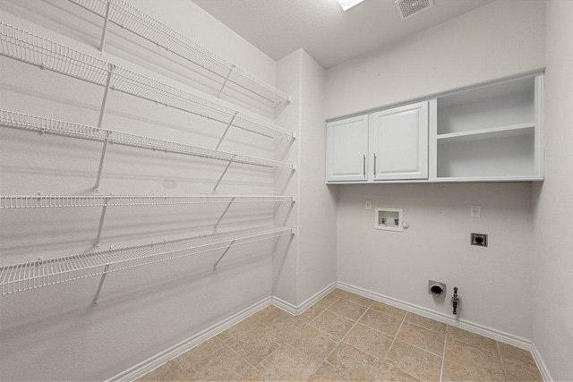901 Middle Brook Dr, Leander, TX 78641 - laundry area featuring electric dryer hookup, gas dryer hookup, visible vents, hookup for a washing machine, and cabinet space