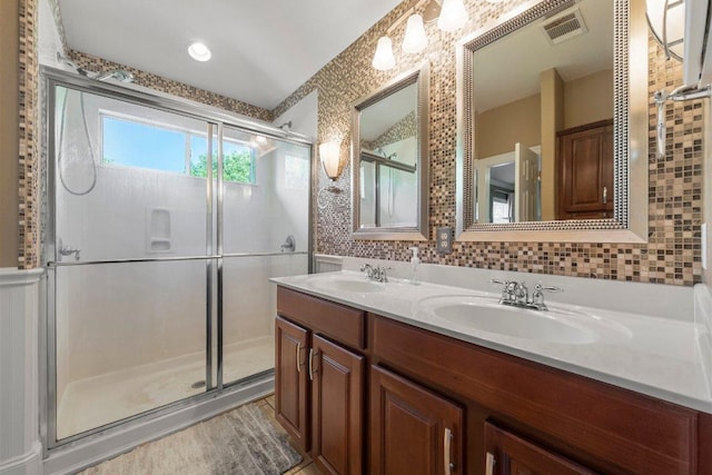 901 Middle Brook Dr, Leander, TX 78641 - full bath with double vanity, visible vents, a sink, and a stall shower