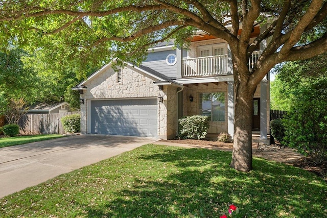 901 Middle Brook Dr, Leander, TX 78641 - traditional home featuring stone siding, a garage, fence, a balcony, and driveway