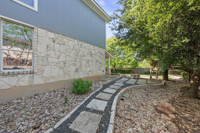 901 Middle Brook Dr, Leander, TX 78641 - view of property exterior featuring stone siding and fence