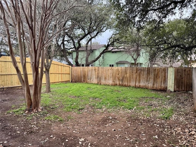 view of yard with a fenced backyard