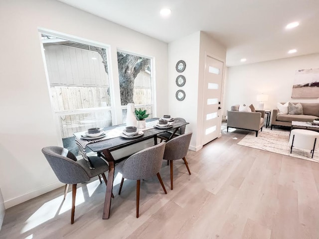 dining area with light wood-style flooring, recessed lighting, and baseboards