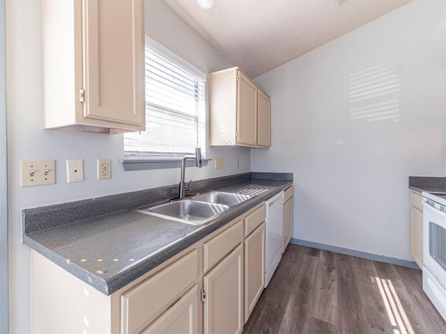9624 Sugar Hill Dr Unit A & B, Austin, TX 78748 - kitchen featuring dark countertops, dark wood-type flooring, and white appliances