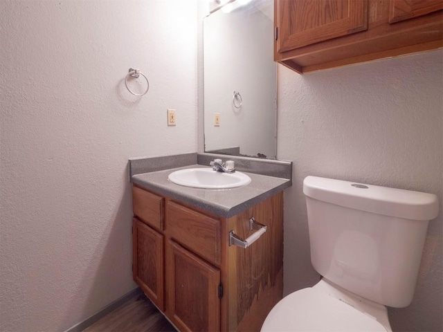 9624 Sugar Hill Dr Unit A & B, Austin, TX 78748 - bathroom featuring vanity, a textured wall, and wood finished floors