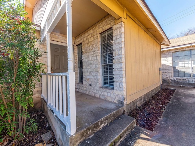 9624 Sugar Hill Dr Unit A & B, Austin, TX 78748 - doorway to property with stone siding and covered porch