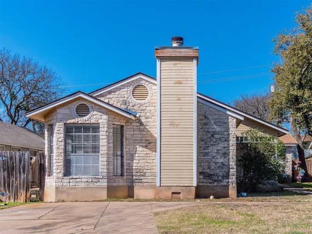 9624 Sugar Hill Dr Unit A & B, Austin, TX 78748 - view of home's exterior with stone siding and a chimney