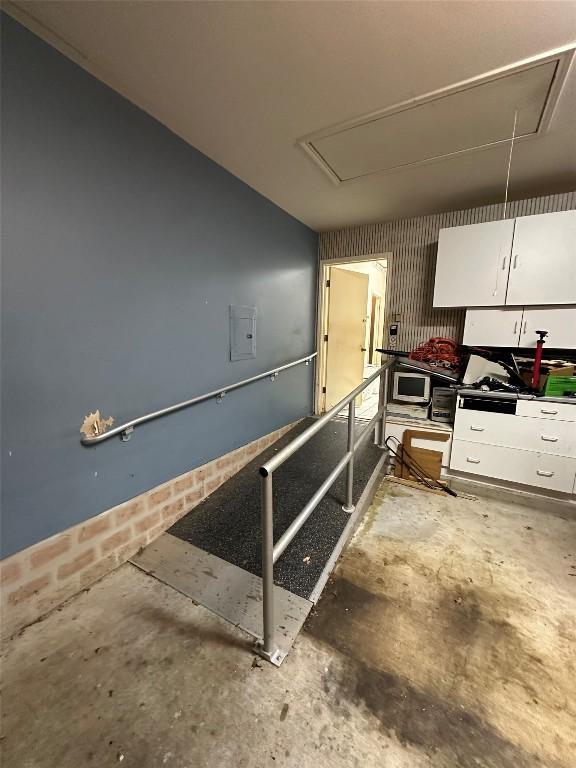 1710 Muledeer Run, Leander, TX 78641 - kitchen featuring concrete flooring and stainless steel microwave