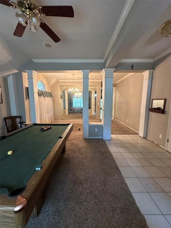 game room with crown molding, tile patterned floors, ornate columns, and a ceiling fan