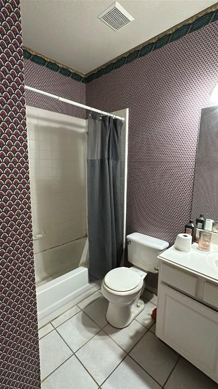 1710 Muledeer Run, Leander, TX 78641 - full bathroom with toilet, shower / tub combo, vanity, and tile patterned floors