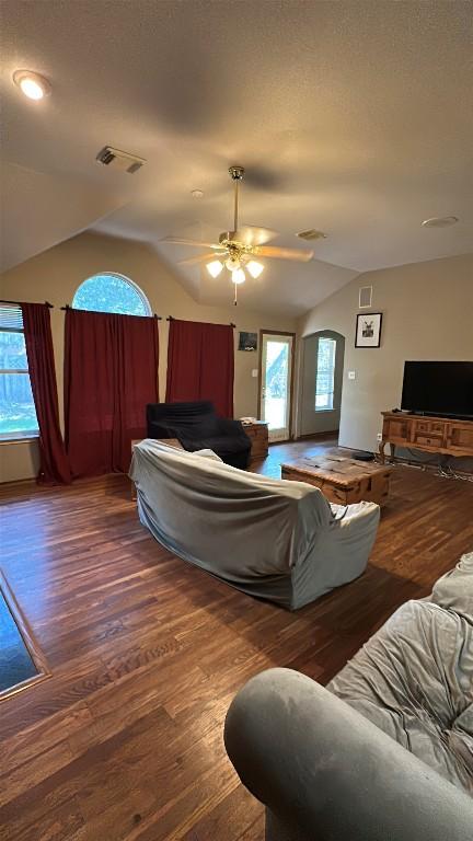 1710 Muledeer Run, Leander, TX 78641 - living room featuring vaulted ceiling, wood finished floors, and a ceiling fan
