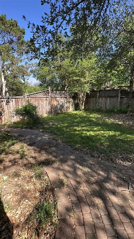view of yard with a patio area and a fenced backyard