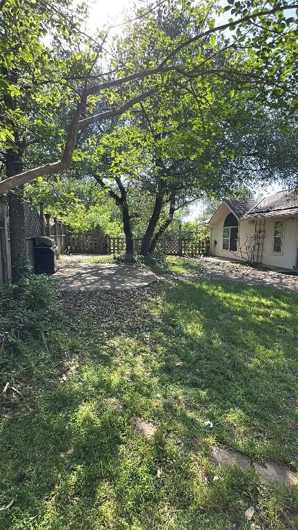 view of yard with fence and a patio
