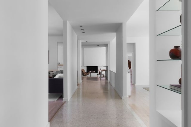 5204 Ridge Oak Dr, Austin, TX 78731 - corridor with dark speckled floor and baseboards