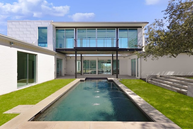 5204 Ridge Oak Dr, Austin, TX 78731 - back of property featuring a patio, an outdoor pool, a lawn, and stucco siding