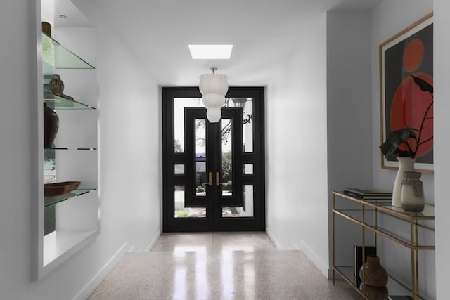 5204 Ridge Oak Dr, Austin, TX 78731 - entrance foyer featuring speckled floor, french doors, and a skylight