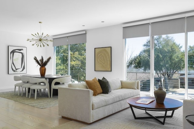 5204 Ridge Oak Dr, Austin, TX 78731 - living area featuring a chandelier, wood finished floors, and recessed lighting
