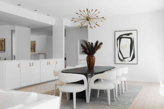 5204 Ridge Oak Dr, Austin, TX 78731 - dining area featuring a chandelier and light wood-type flooring