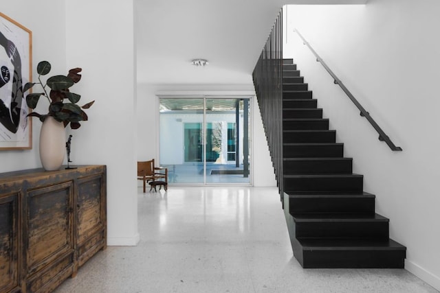 5204 Ridge Oak Dr, Austin, TX 78731 - stairway with speckled floor and baseboards