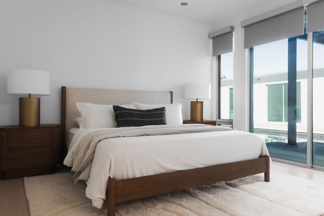 5204 Ridge Oak Dr, Austin, TX 78731 - bedroom with access to exterior and wood finished floors
