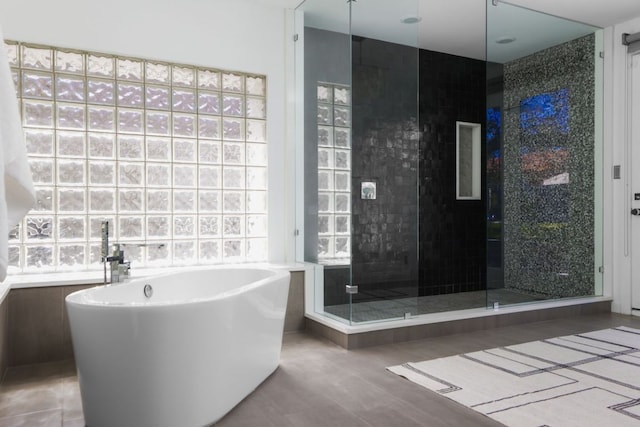5204 Ridge Oak Dr, Austin, TX 78731 - full bathroom with a soaking tub and a stall shower