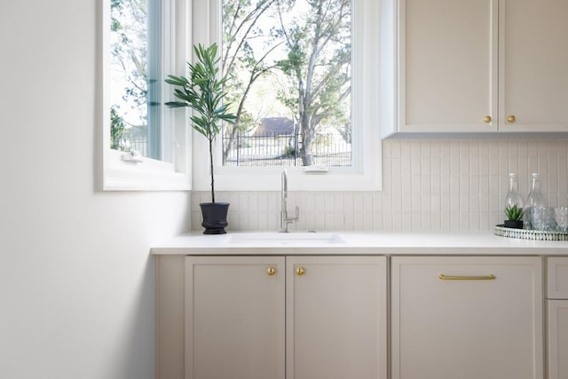2809 Waterbank Cv, Austin, TX 78746 - bar with a sink and decorative backsplash