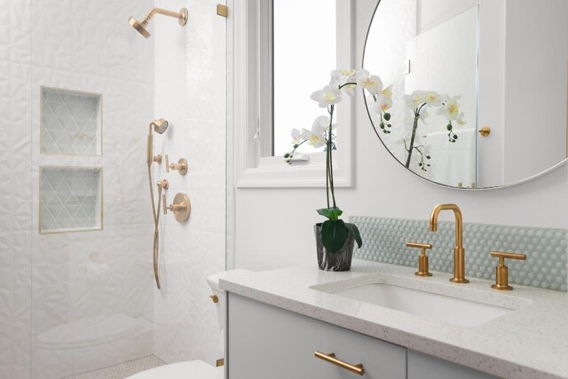 2809 Waterbank Cv, Austin, TX 78746 - bathroom with vanity, tiled shower, and tasteful backsplash