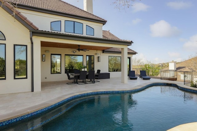 2809 Waterbank Cv, Austin, TX 78746 - back of property featuring ceiling fan, stucco siding, a patio, a chimney, and a tiled roof