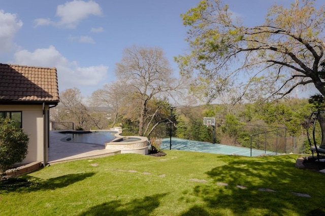 2809 Waterbank Cv, Austin, TX 78746 - view of grassy yard with basketball court and a pool with connected hot tub