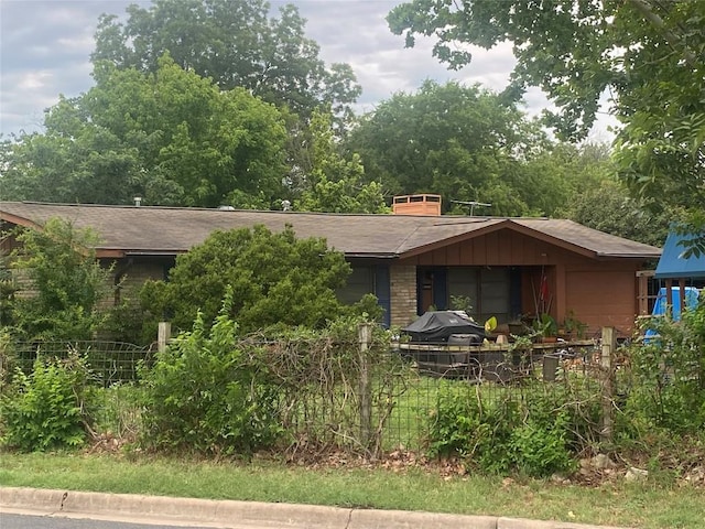 4623 Philco Dr, Austin, TX 78745 - view of front facade with roof with shingles and a chimney