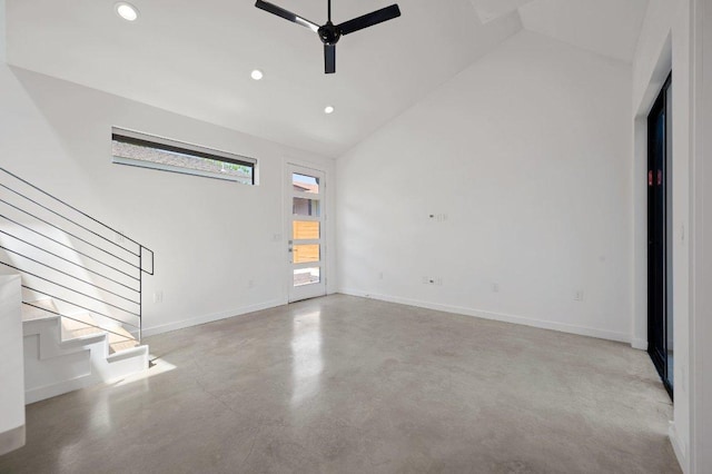 unfurnished living room featuring ceiling fan, stairs, baseboards, high vaulted ceiling, and recessed lighting