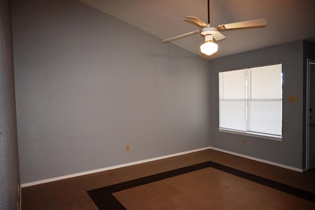 817 Lexington Rd, Elgin, TX 78621 - spare room with baseboards, a ceiling fan, and vaulted ceiling