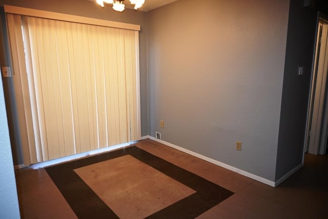 817 Lexington Rd, Elgin, TX 78621 - unfurnished room featuring visible vents, baseboards, and a notable chandelier