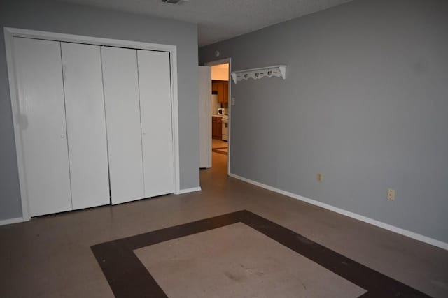 817 Lexington Rd, Elgin, TX 78621 - unfurnished bedroom featuring a closet, baseboards, and visible vents