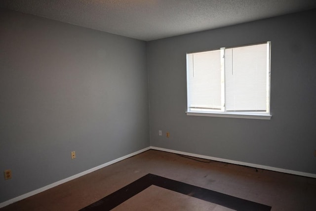 817 Lexington Rd, Elgin, TX 78621 - spare room featuring baseboards and a textured ceiling