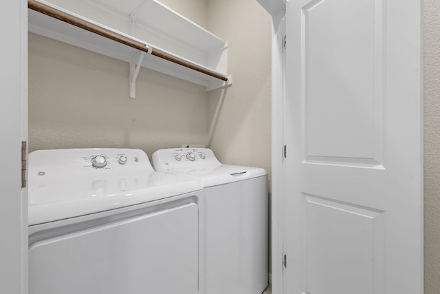 washroom with washer and dryer and laundry area