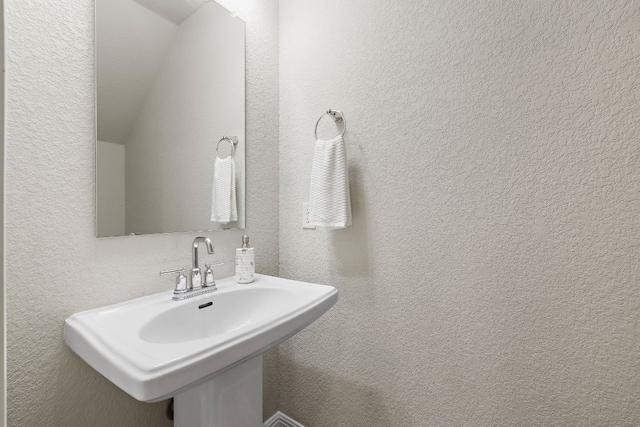 9015 Cattle Baron Path Unit 504, Austin, TX 78747 - bathroom with a sink and a textured wall
