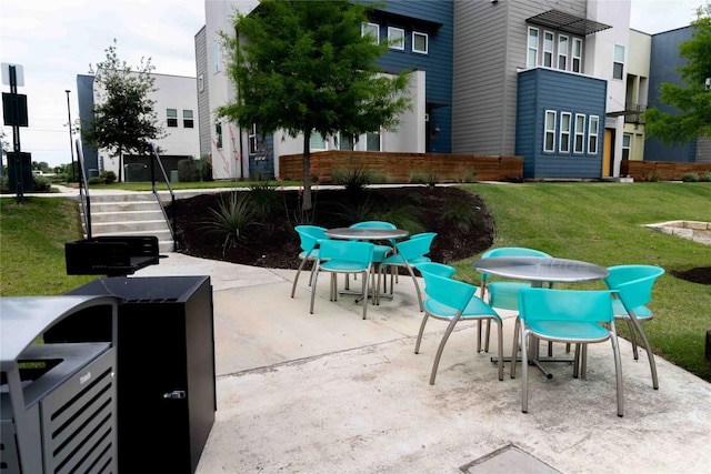 9015 Cattle Baron Path Unit 504, Austin, TX 78747 - view of patio featuring outdoor dining space and stairway
