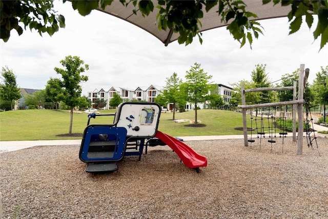 community jungle gym with a lawn