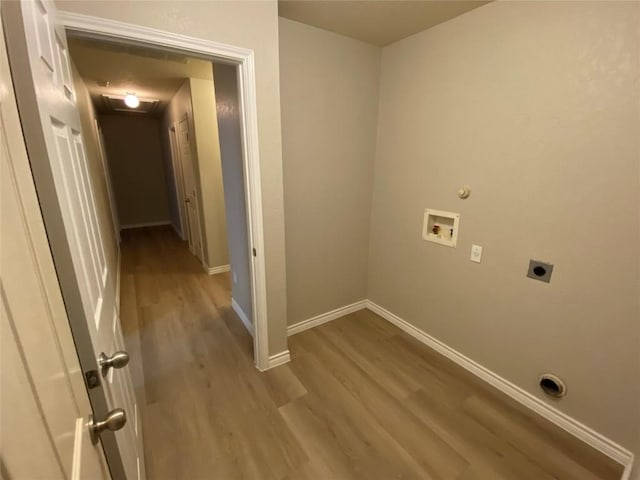 clothes washing area with laundry area, wood finished floors, washer hookup, and electric dryer hookup
