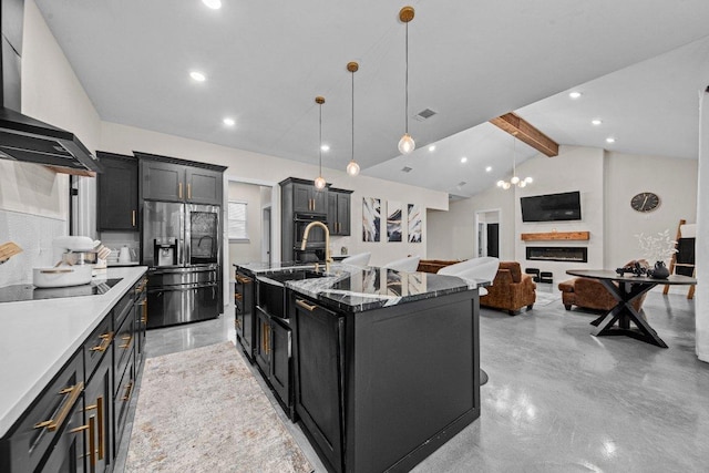 7143 Kc Ranch Ct, Temple, TX 76501 - kitchen with dark cabinetry, black appliances, wall chimney exhaust hood, and lofted ceiling with beams