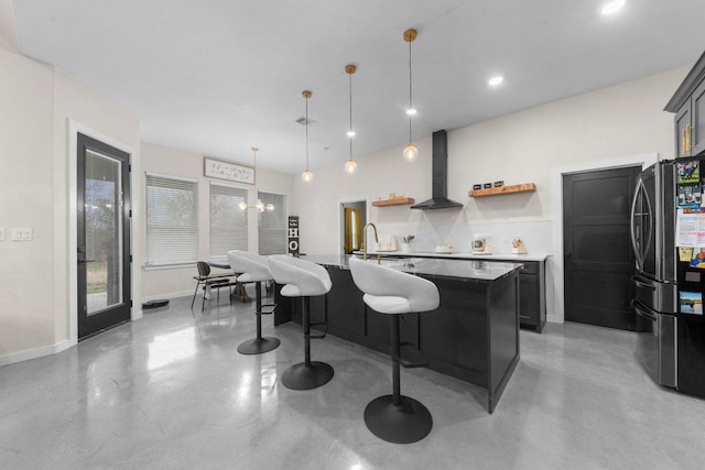 7143 Kc Ranch Ct, Temple, TX 76501 - kitchen featuring concrete flooring, open shelves, freestanding refrigerator, and wall chimney exhaust hood