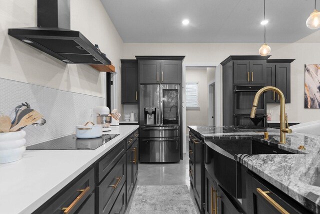 7143 Kc Ranch Ct, Temple, TX 76501 - kitchen featuring stainless steel fridge, wall chimney range hood, black electric stovetop, pendant lighting, and finished concrete floors