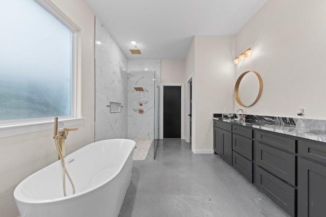 7143 Kc Ranch Ct, Temple, TX 76501 - bathroom featuring a freestanding tub, concrete floors, double vanity, a marble finish shower, and a sink