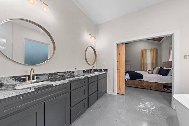 7143 Kc Ranch Ct, Temple, TX 76501 - full bath with double vanity, concrete floors, a sink, and connected bathroom