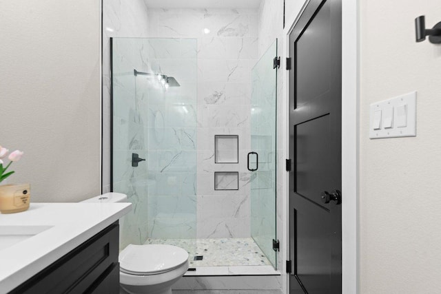7143 Kc Ranch Ct, Temple, TX 76501 - bathroom featuring a marble finish shower, toilet, and vanity